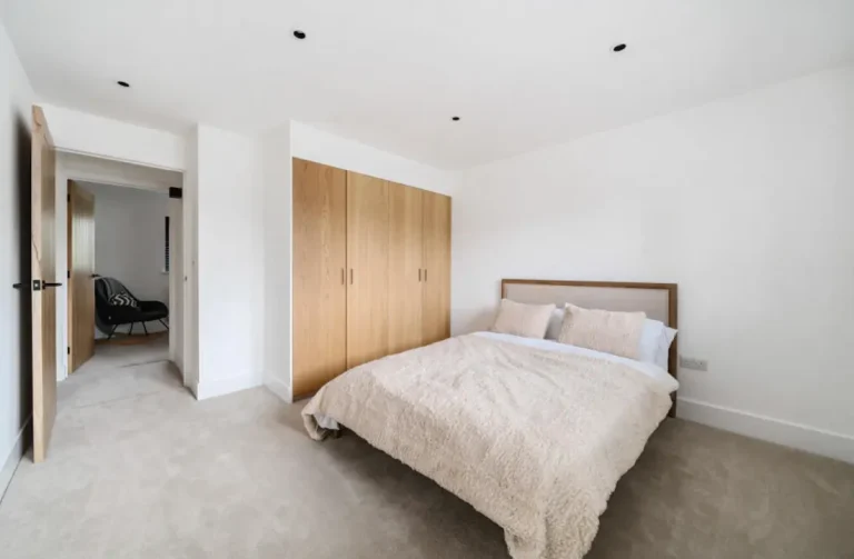 Double storey house extensions in Basildon with kitchen, open-plan living, and en-suite bedroom designs by Essex architects